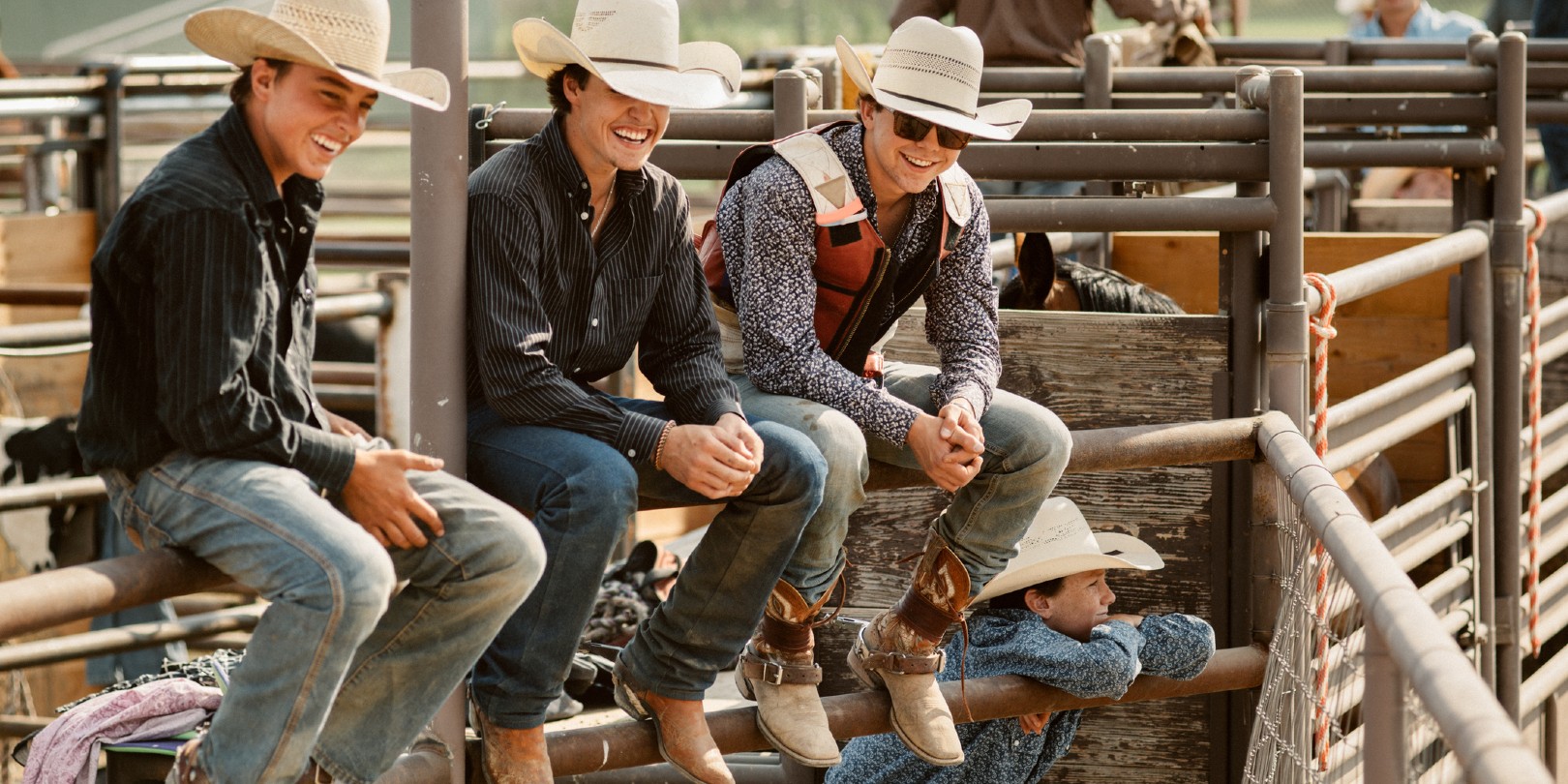 Group of Cowboys Friends Hanging out at Rodeo Arena